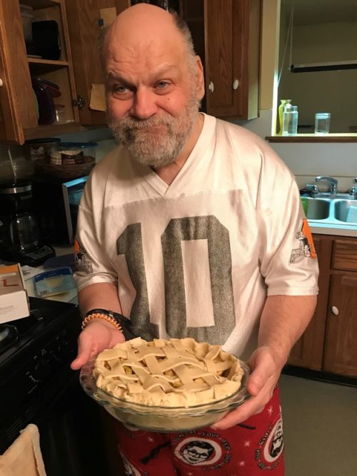 Dave holds an apple pie before putting it in the oven